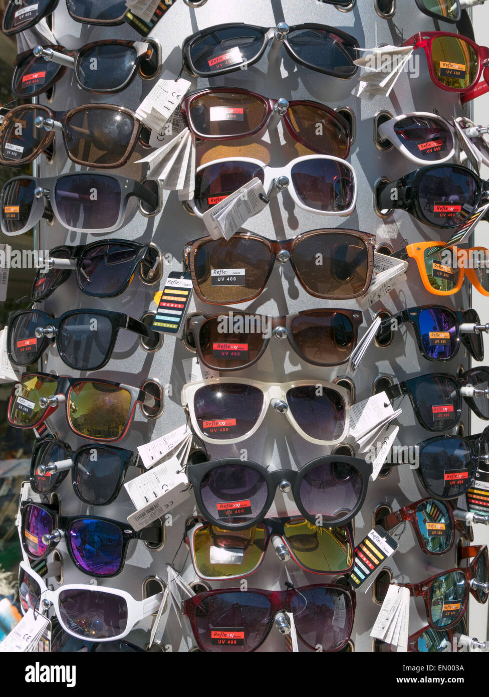 Lots of pairs of sunglasses outside a shop in Plymouth, England on a sunny day. Stock Photo