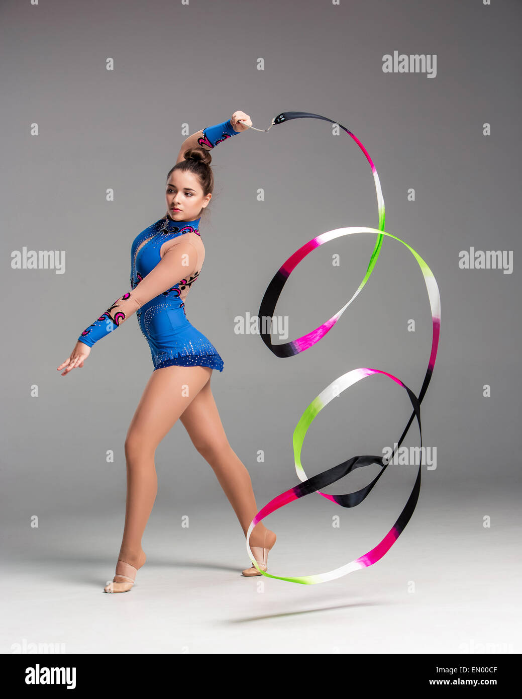 teenager doing gymnastics dance with ribbon Stock Photo - Alamy