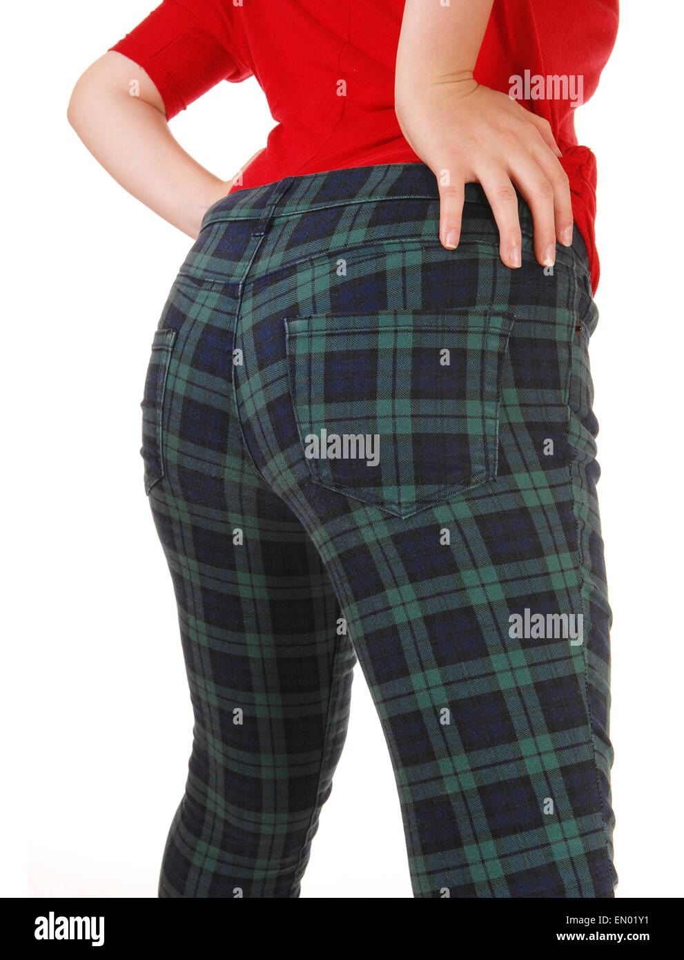 A closeup picture of the back and butt of a young woman in pants