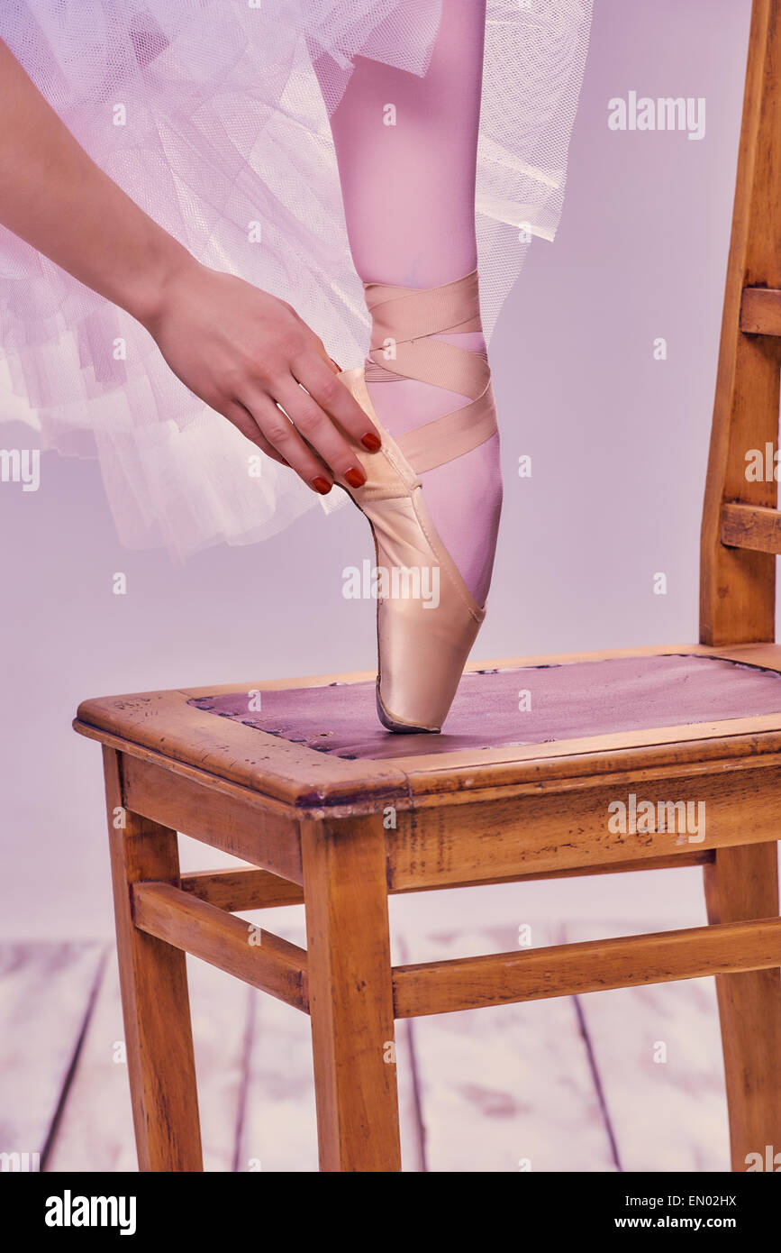 ballerina putting on shoes