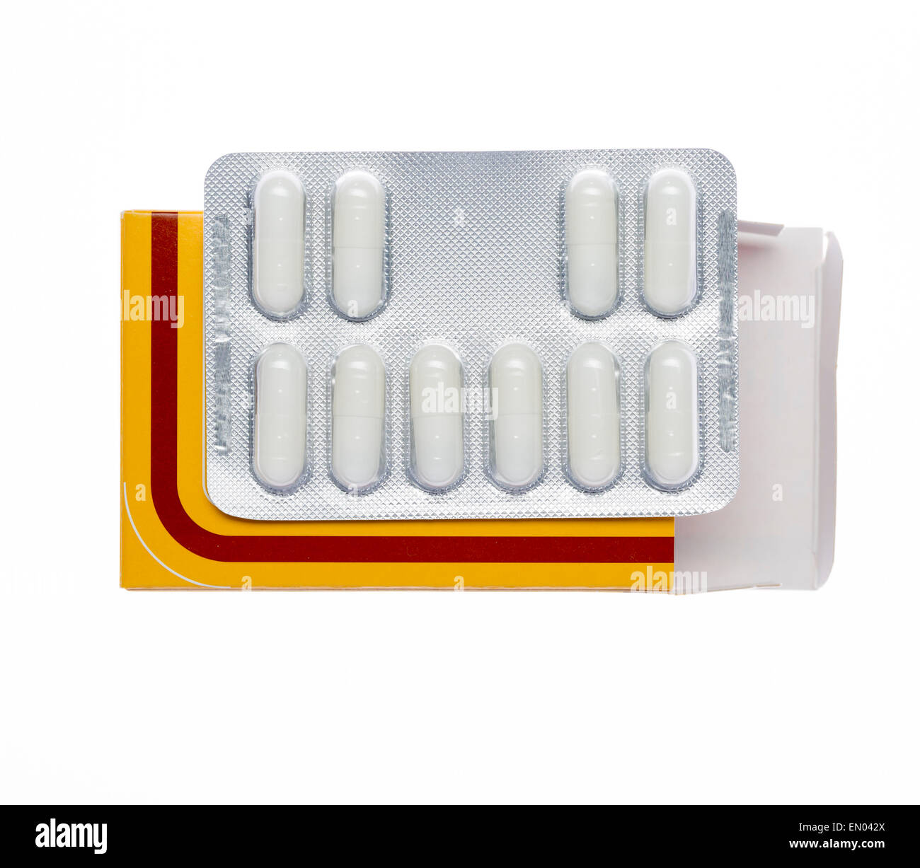 Yellow box with white pills blister pack on an isolated background Stock Photo