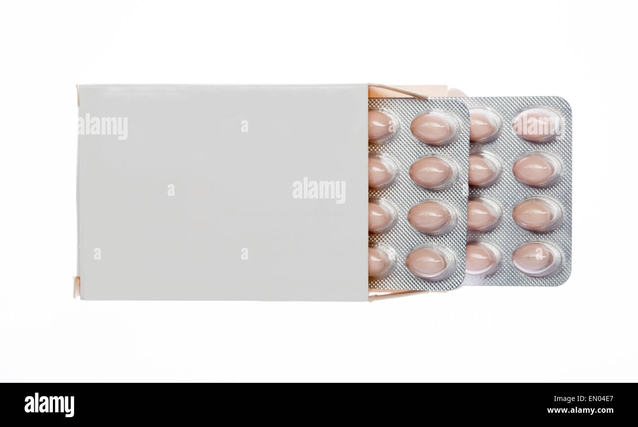 White box with brown pills blister pack on an isolated background Stock Photo