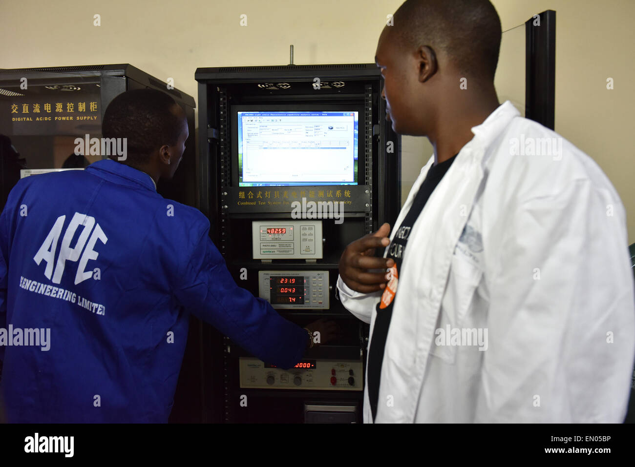 Nairobi, Kenya. 24th Apr, 2015. Two trainees operate a testing system