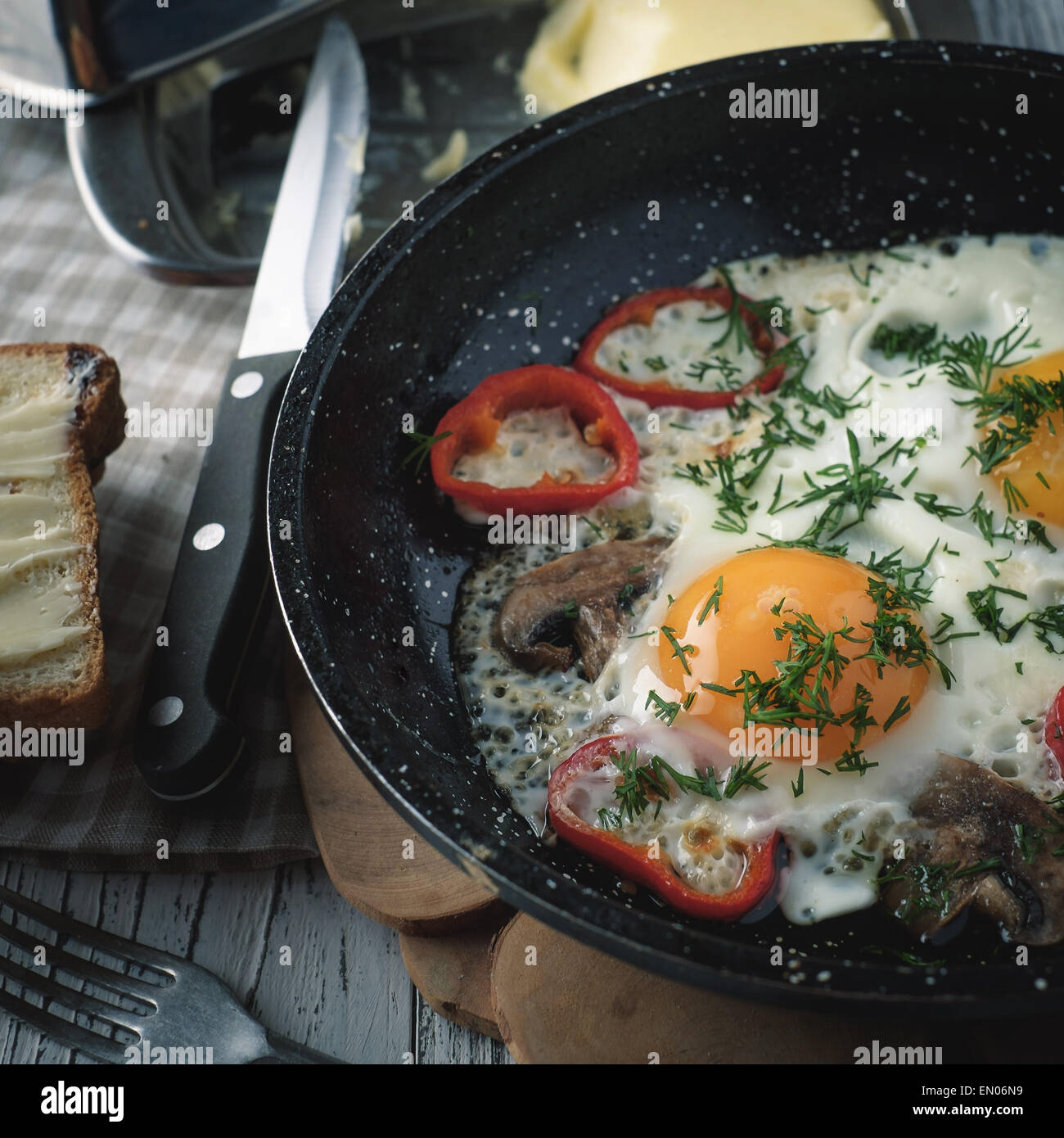 Fried egg for breakfast in the countryside. Low contrast. Instagram style. Stock Photo