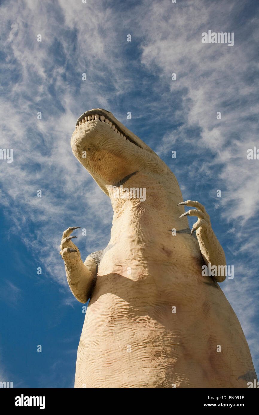 The view up of a tyrannosaurus rex statue in the California desert