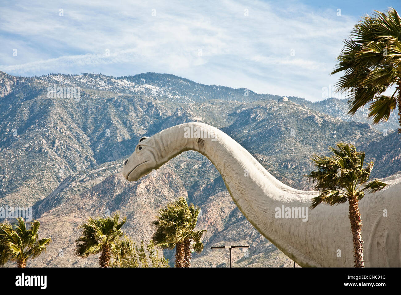 A statue of an dinosaur sits alongside route 10 west in the California