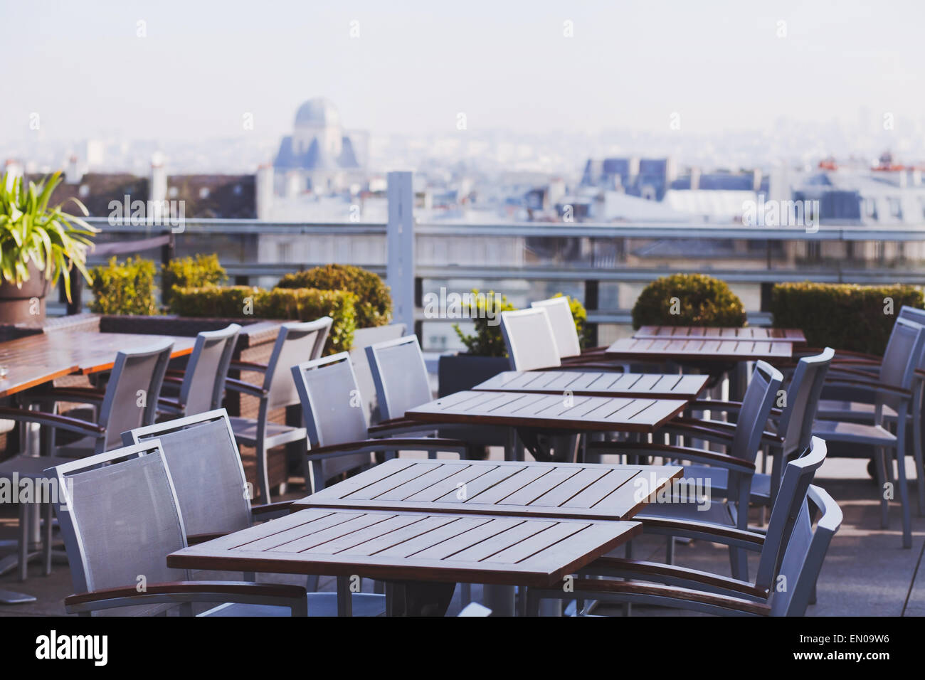 rooftop cafe, open terrace with wooden tables Stock Photo