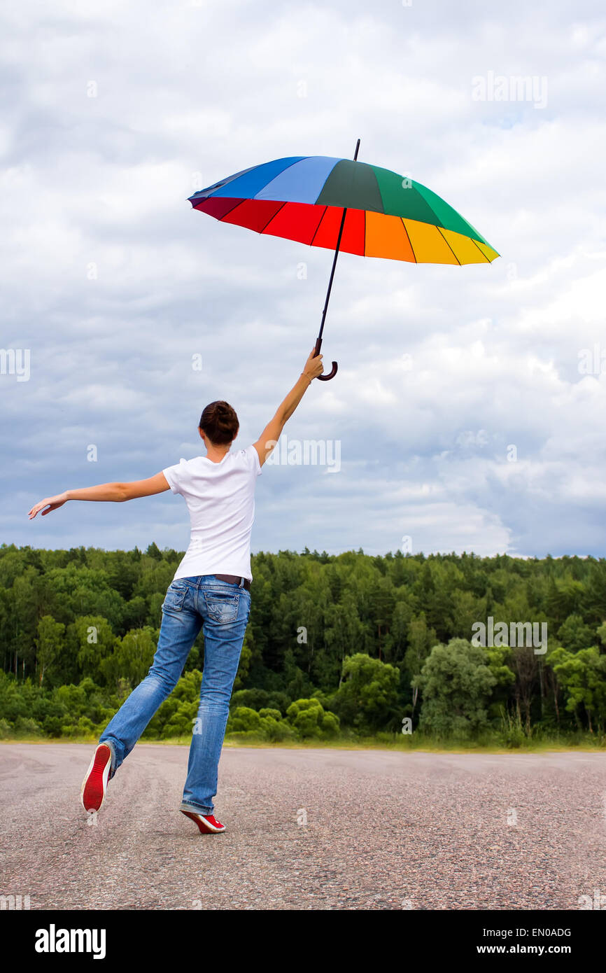 Woman with colorful umbrella Stock Photo