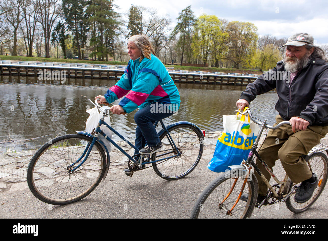 Elderly man and woman ride on bicycles, Podebrady, Czech Republic Stock Photo