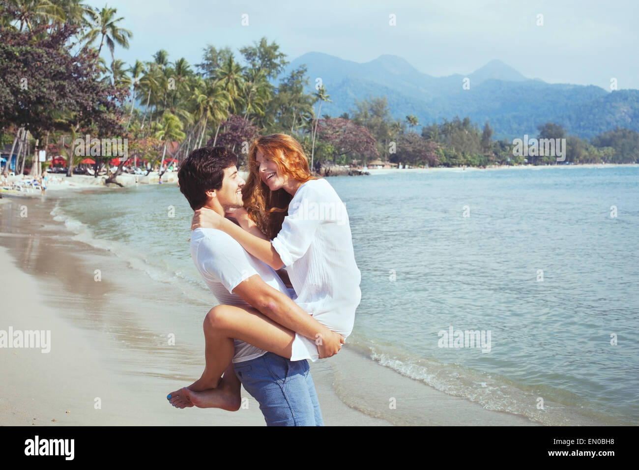 happy young family on the beach, couple during honeymoon Stock Photo