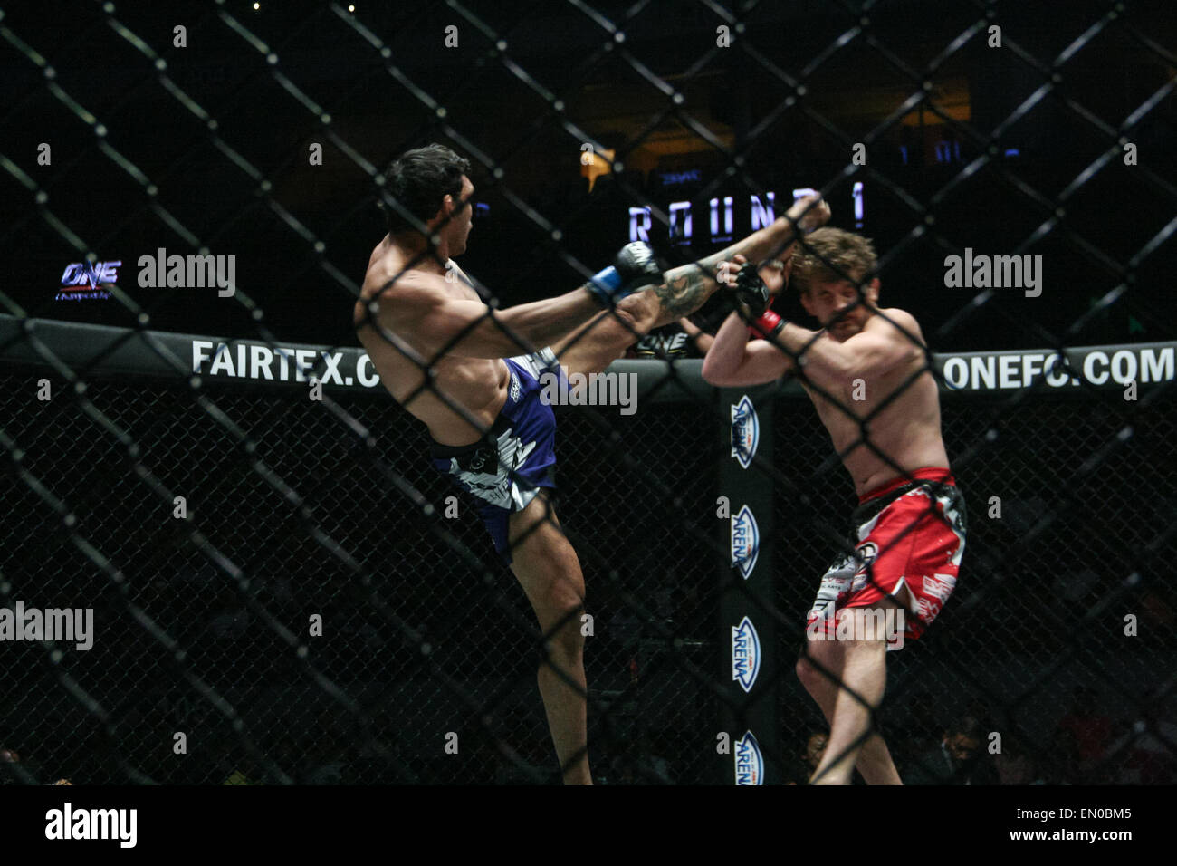Pasay, Philippines. 24th Apr, 2015. Luis Santos delivers a head kick on ...