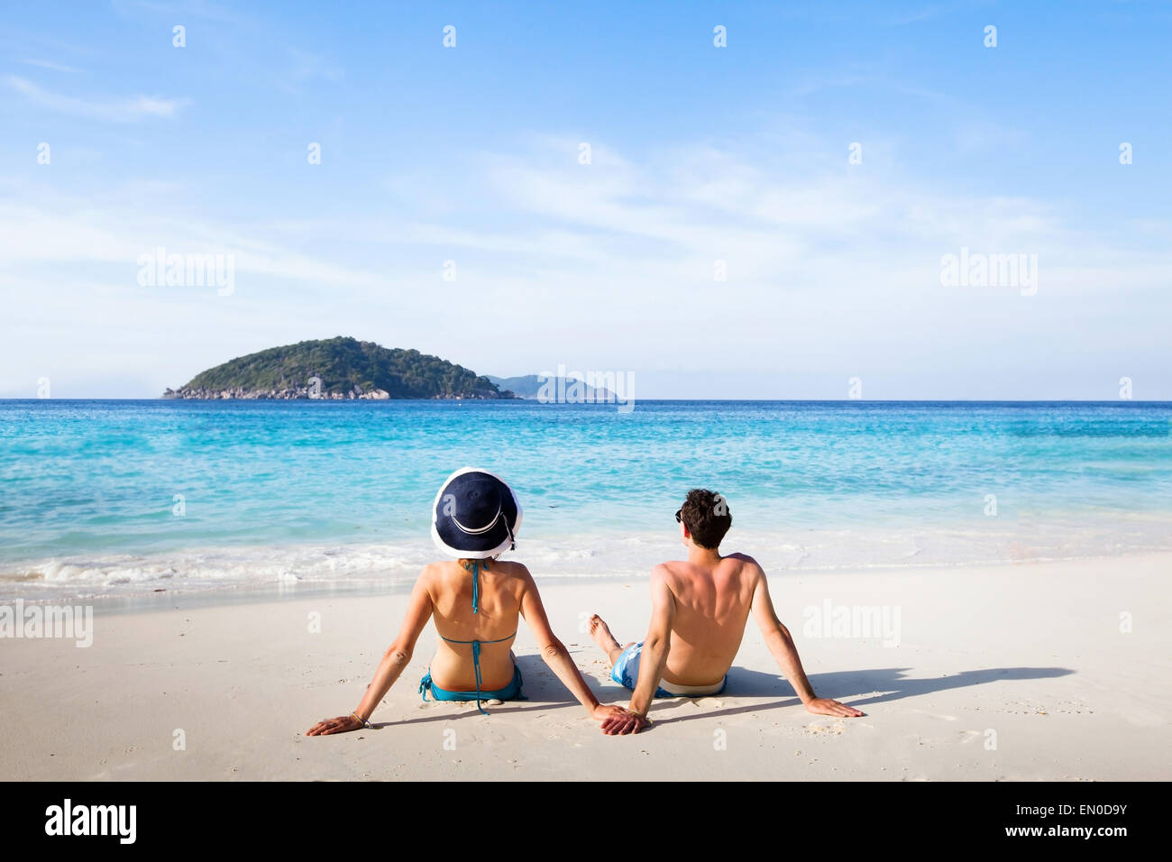 honeymoon destination, young happy couple relaxing on paradise beach Stock Photo