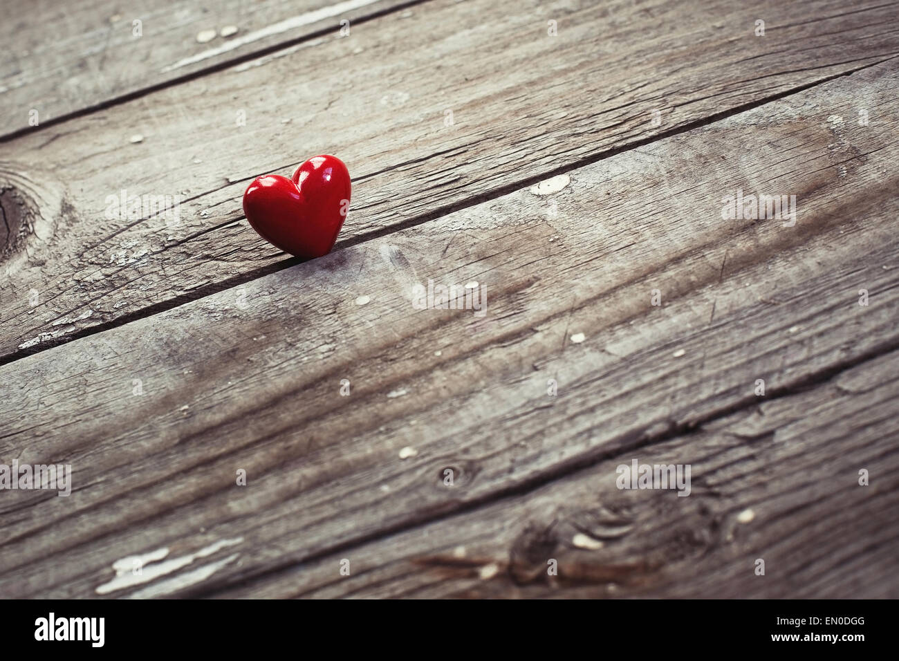 red heart on wooden desk Stock Photo