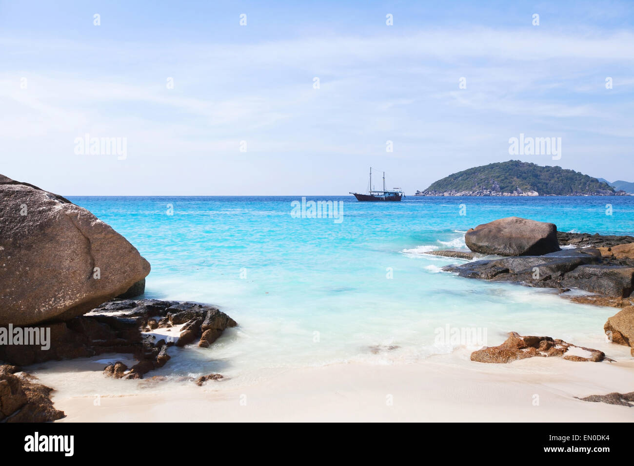 beautiful seascape, paradise island with sailing boat on horizon Stock Photo