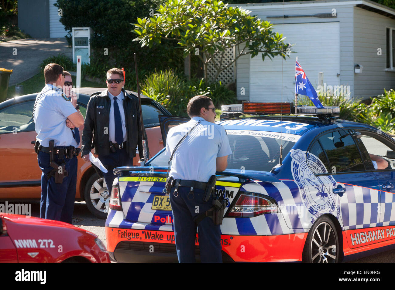 Sydney, Australia. 25th Apr, 2015. Centenary ANZAC day remembrance service and march on 25th april at palm beach sydney  to remember those who perished in world war one at Gallipoli. NSW Sydney police officers on patrol with their police car Credit:  martin berry/Alamy Live News Stock Photo