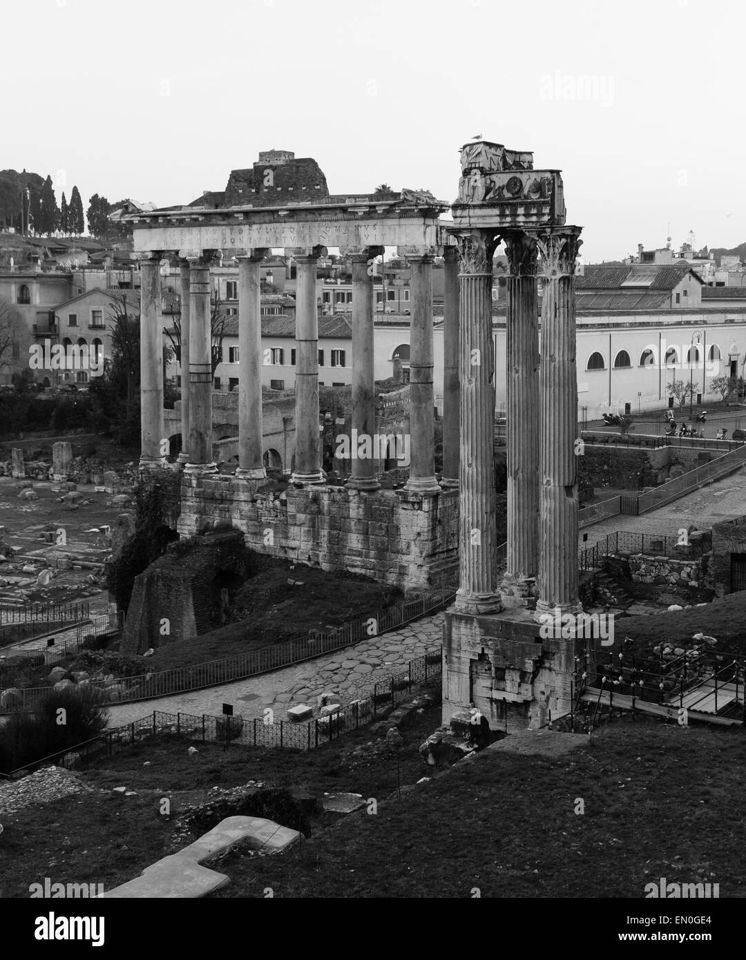 Part of the Temple of Saturn and Temple of Vespasian and Titus ruins in Rome Stock Photo