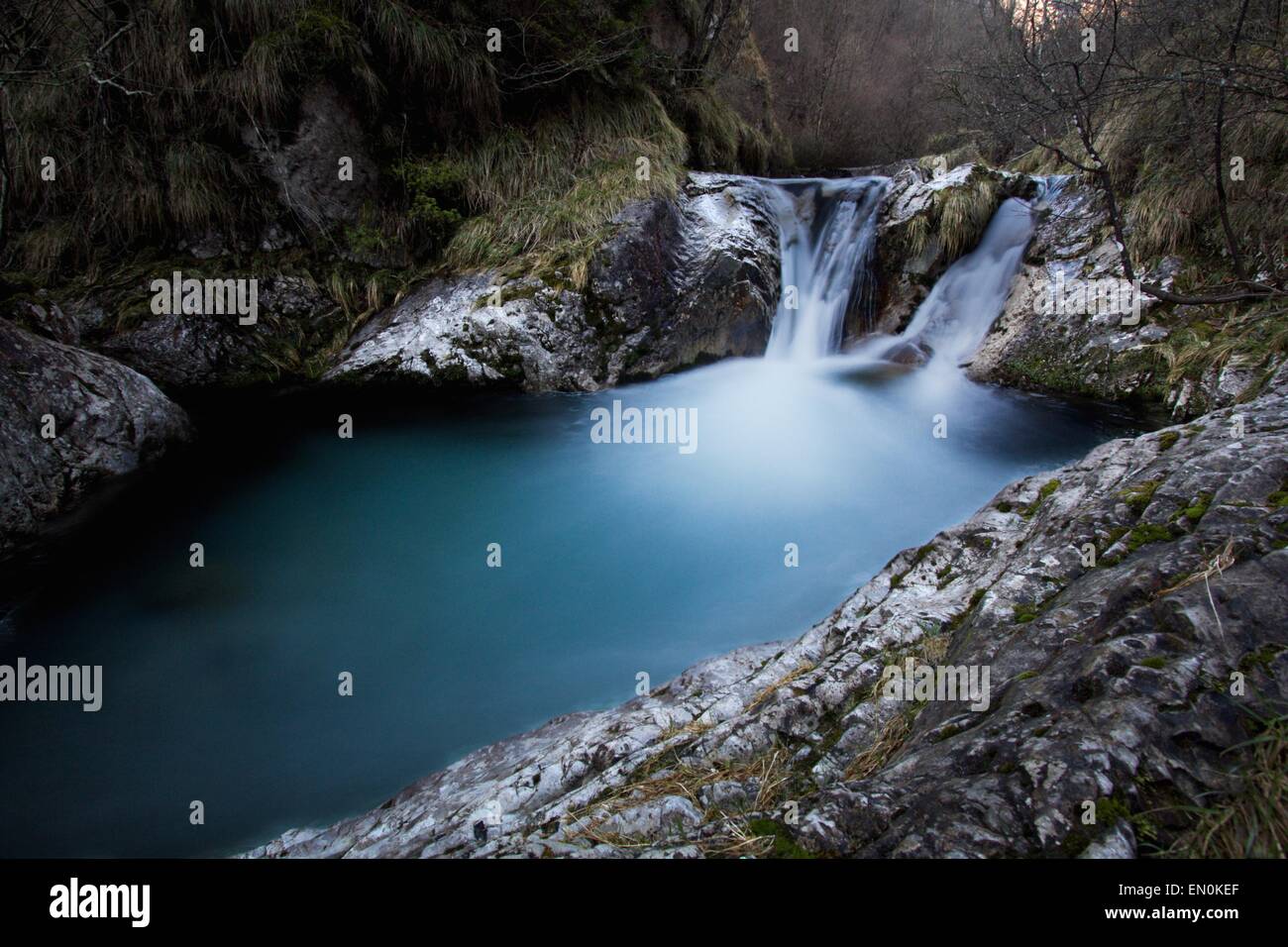 a view of a waterfall in a wood Stock Photo - Alamy