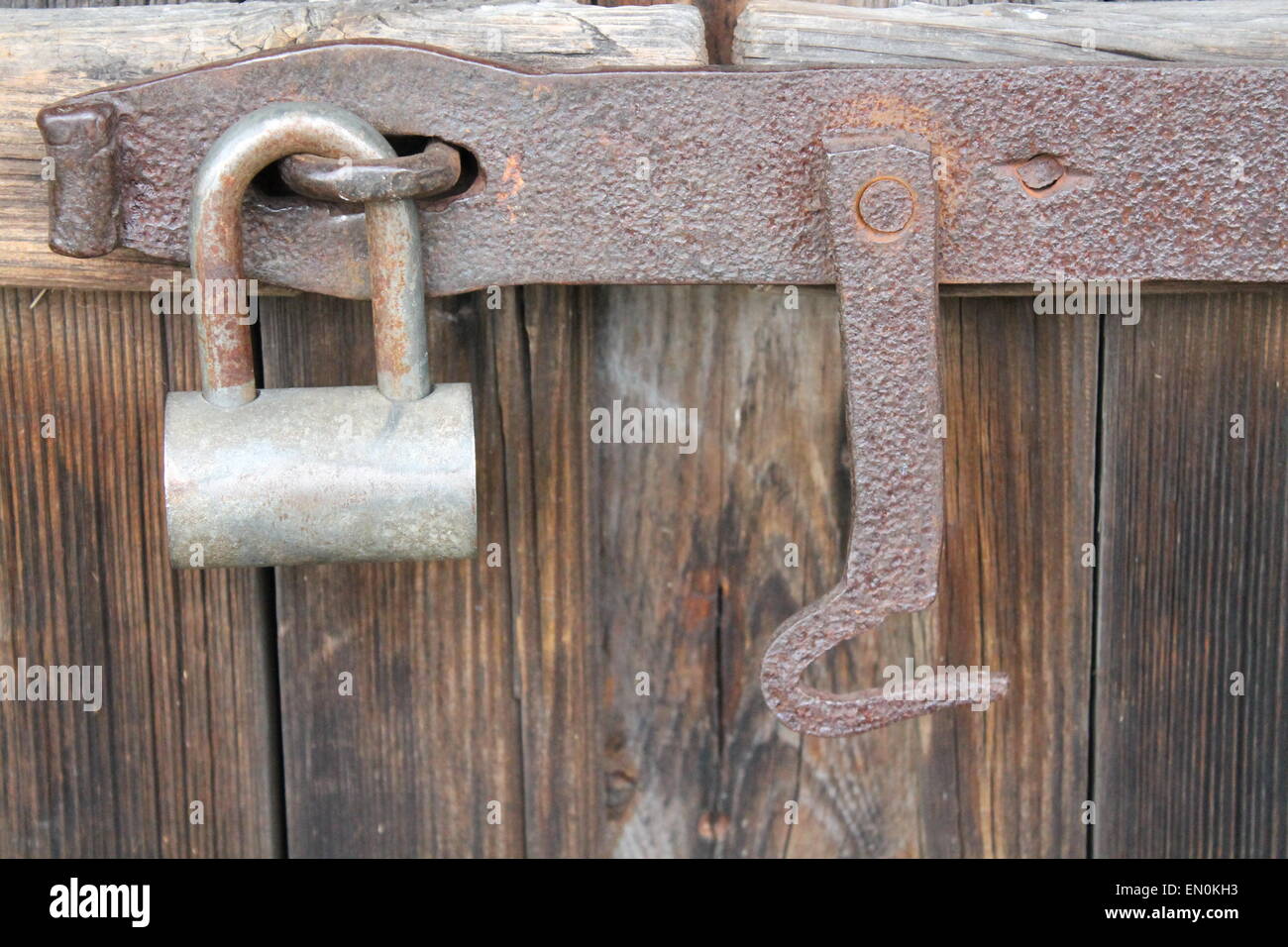 metal old lock hang on door with rusty hook Stock Photo Alamy