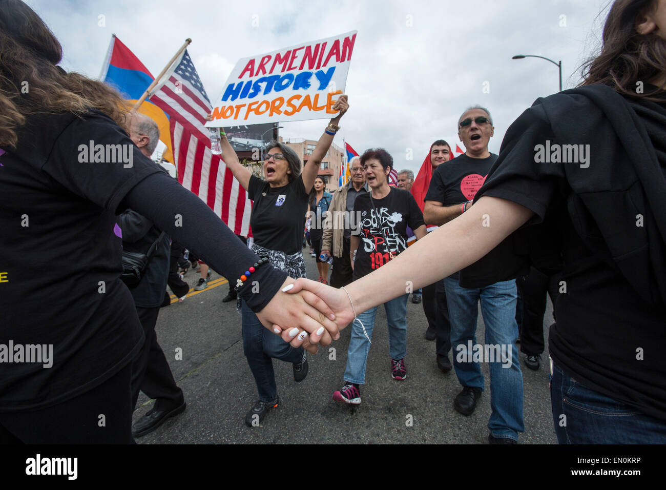 Los Angeles, USA. 24th Apr, 2015. A woman holds a placard during the rally marking the 100th anniversary of a genocide against the Armenians, in Los Angeles, the United States, on April 24, 2015. Demonstrators holding placards and national flags of Armenia marched to the consulate of Turkey in Los Angeles to mark the 100th anniversary of a genocide against the Armenians. Credit:  Zhao Hanrong/Xinhua/Alamy Live News Stock Photo
