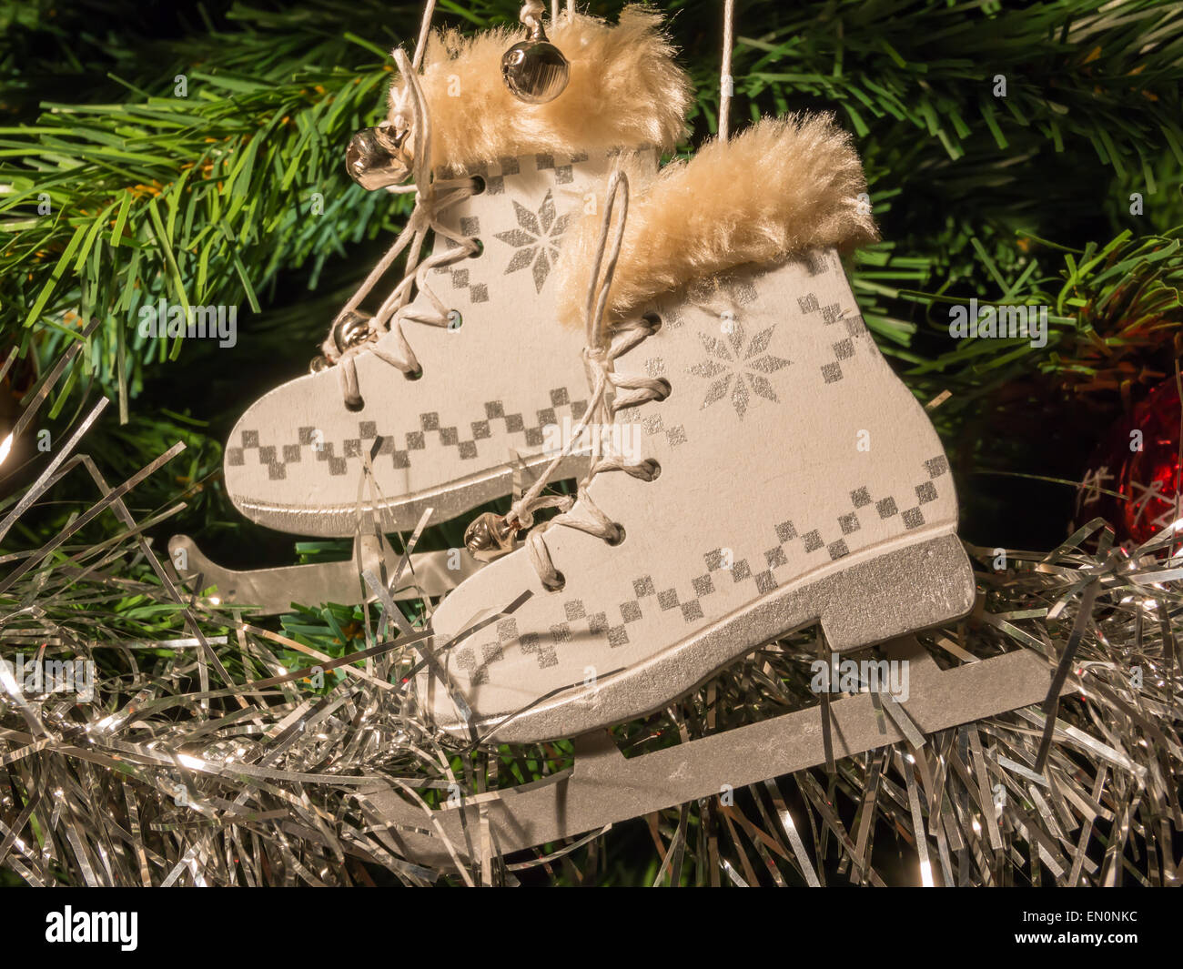 White Ice Skate Christmas Decoration On Green Christmas Tree Stock
