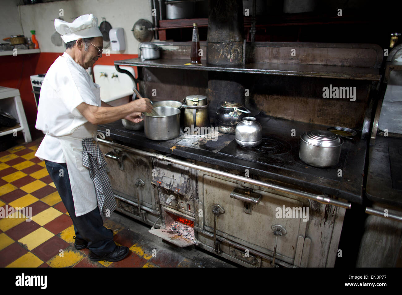cook at work in Guatemala city market Stock Photo