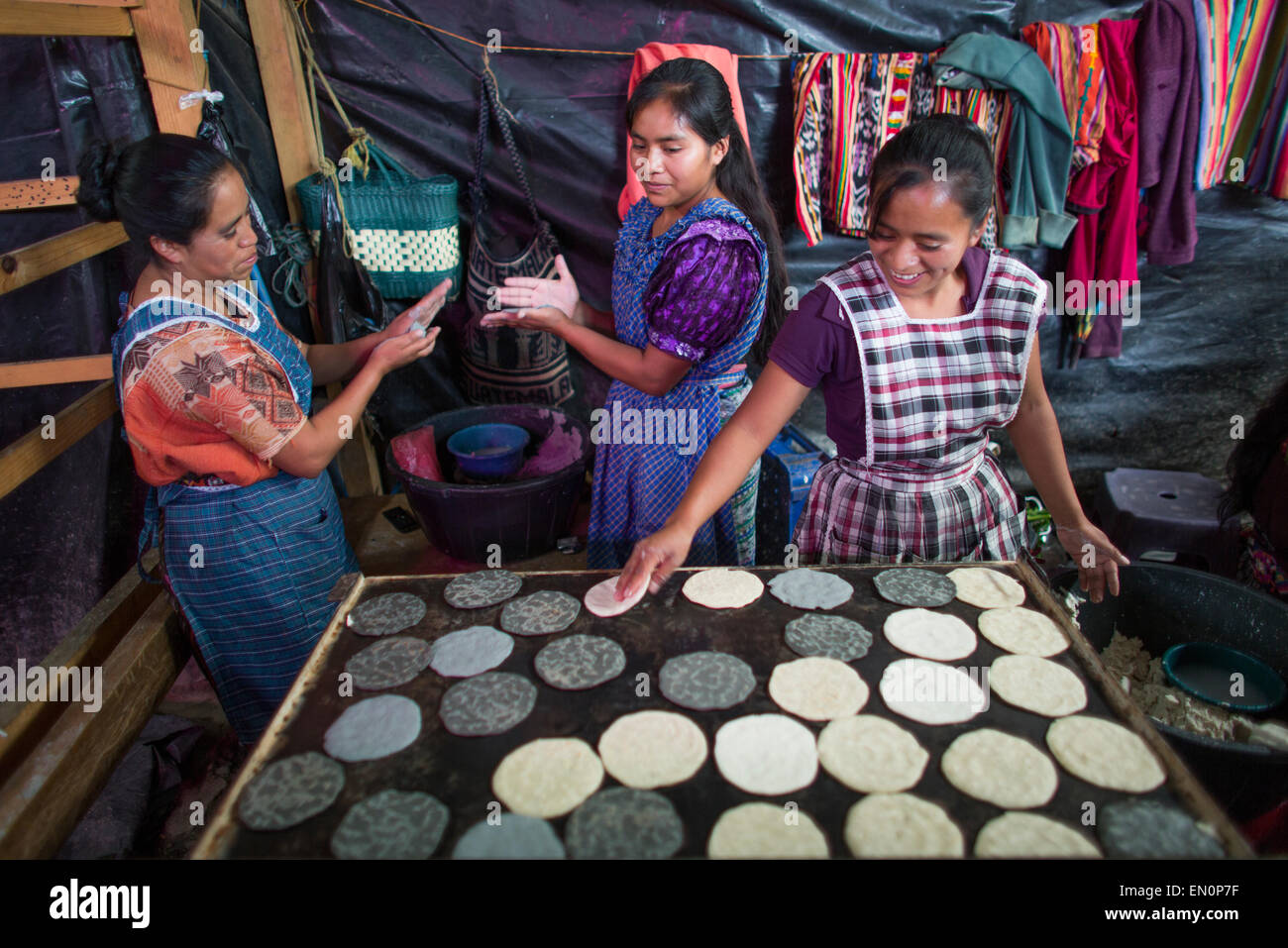 cook at work in Guatemala city market Stock Photo