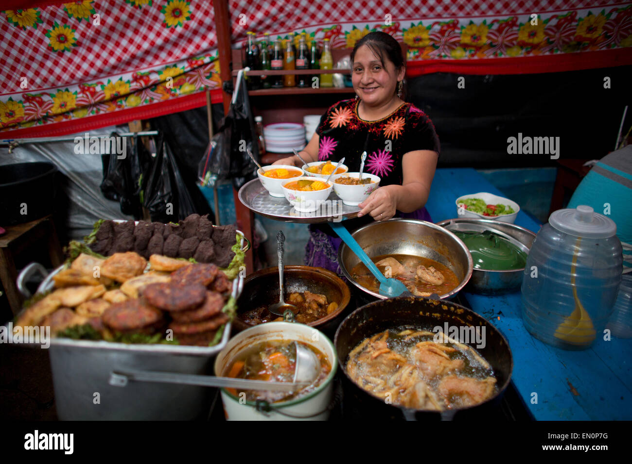 cook at work in Guatemala city market Stock Photo