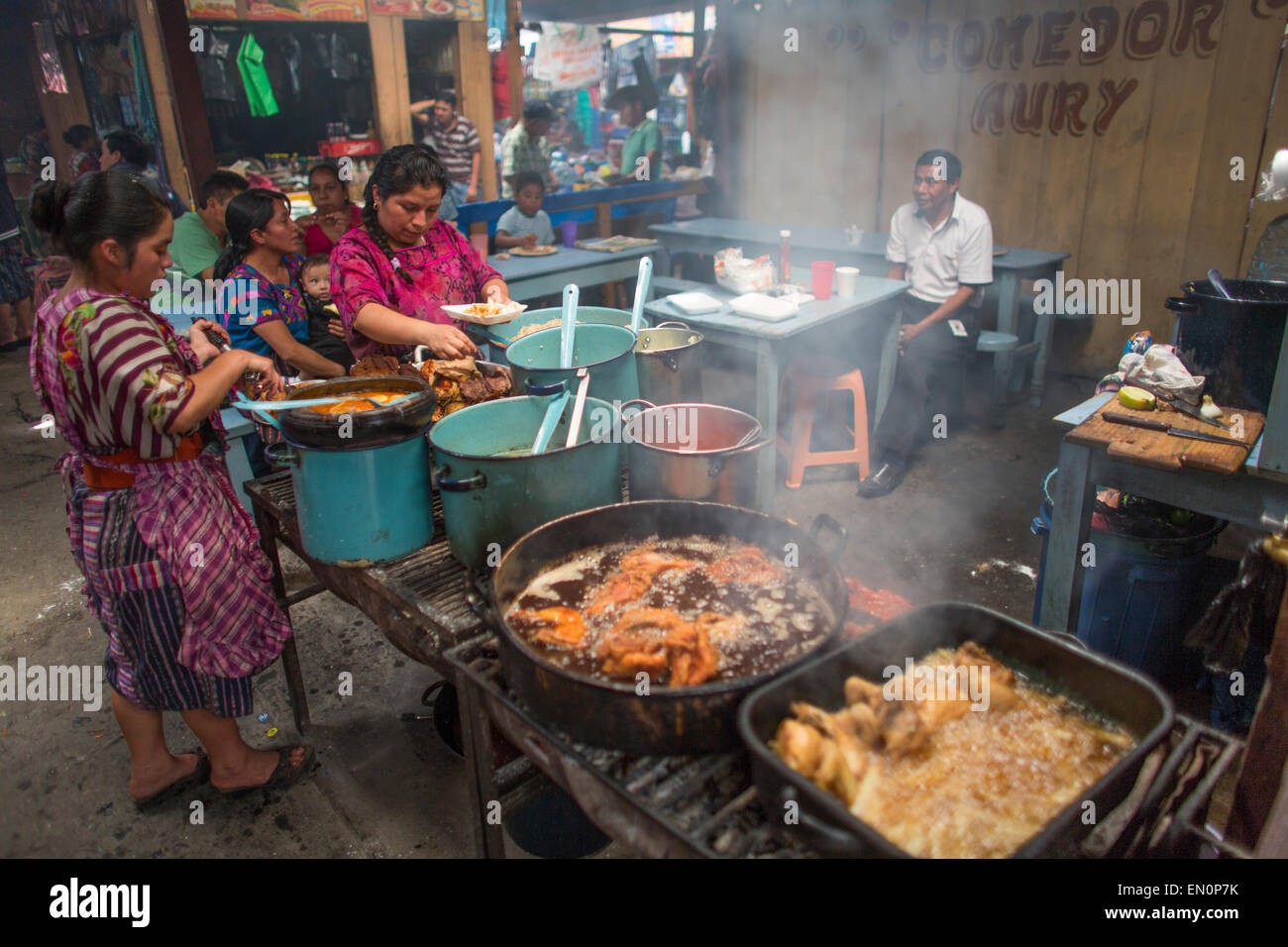 cook at work in Guatemala city market Stock Photo