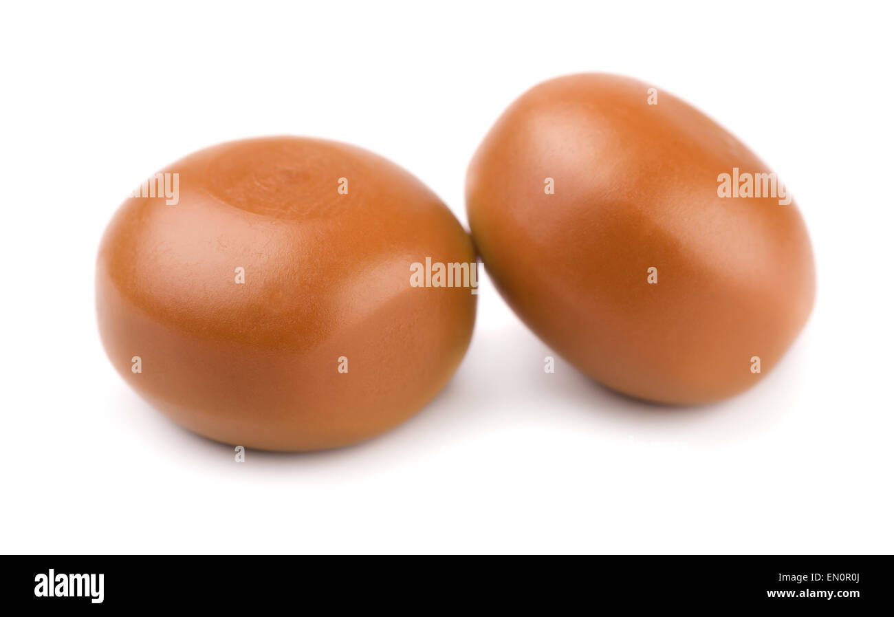 Two caramel candies isolated on white Stock Photo