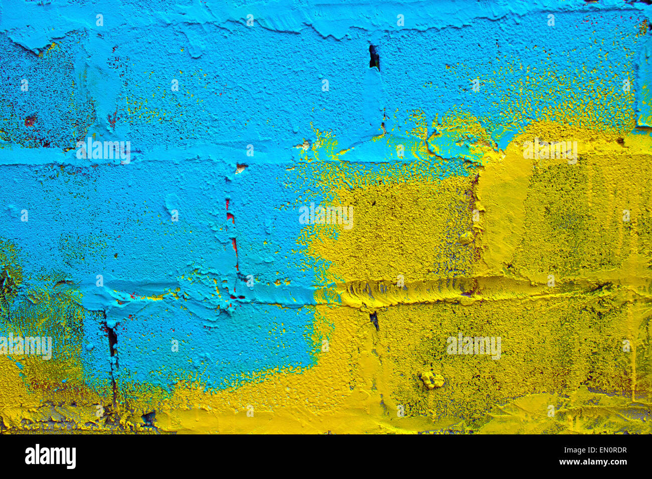 Blue-yellow paint on a wall Stock Photo