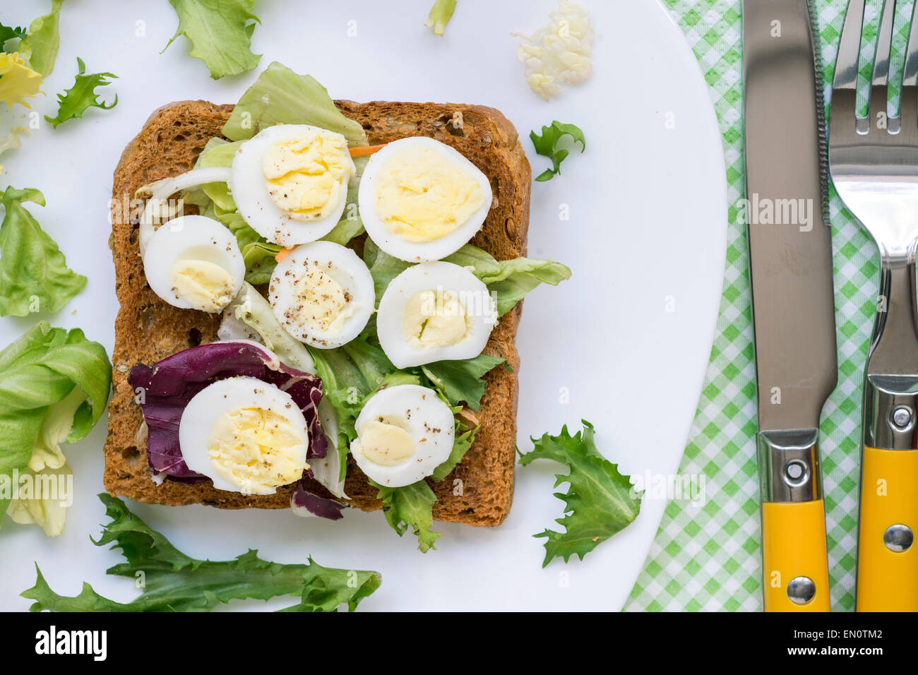 healthy boiled quail egg sandwich on white plate Stock Photo