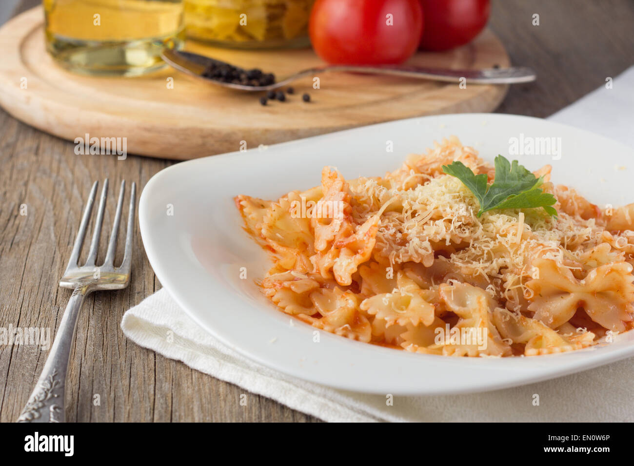 Farfalle with tomato sauce and cheese horizontal selective focus Stock Photo