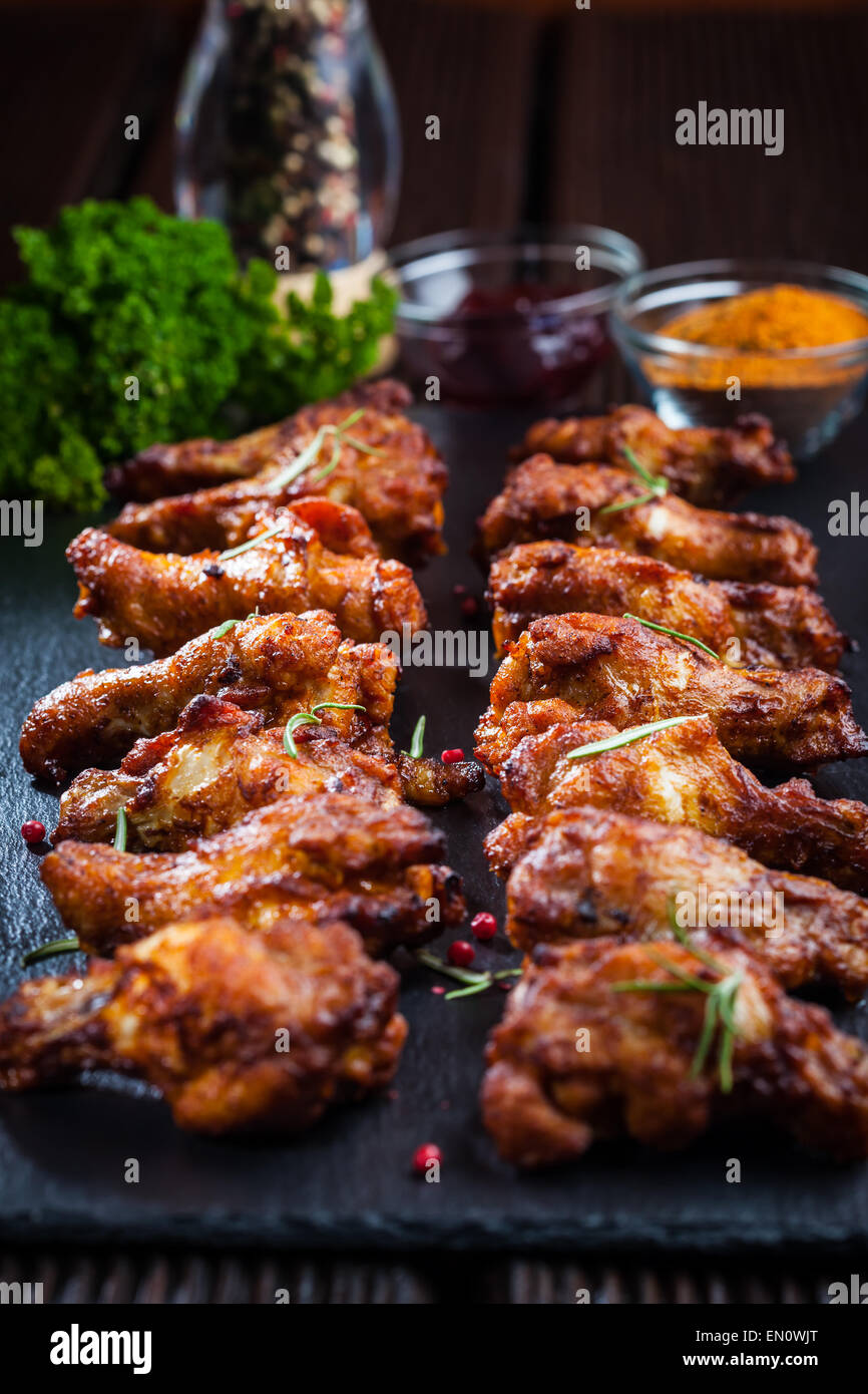 BBQ chicken wings with spices and dips Stock Photo