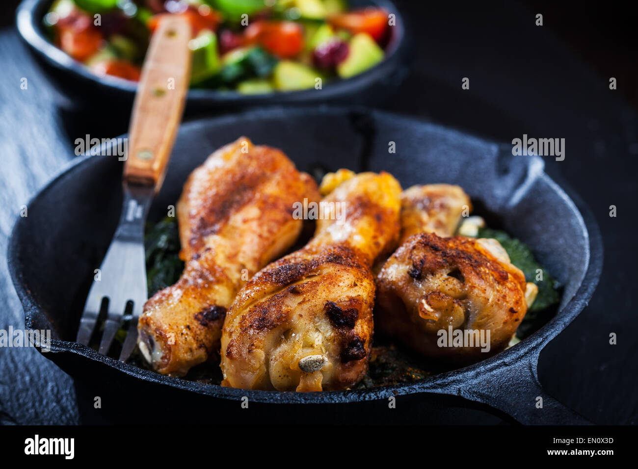 Crispy chicken legs in a pan Stock Photo