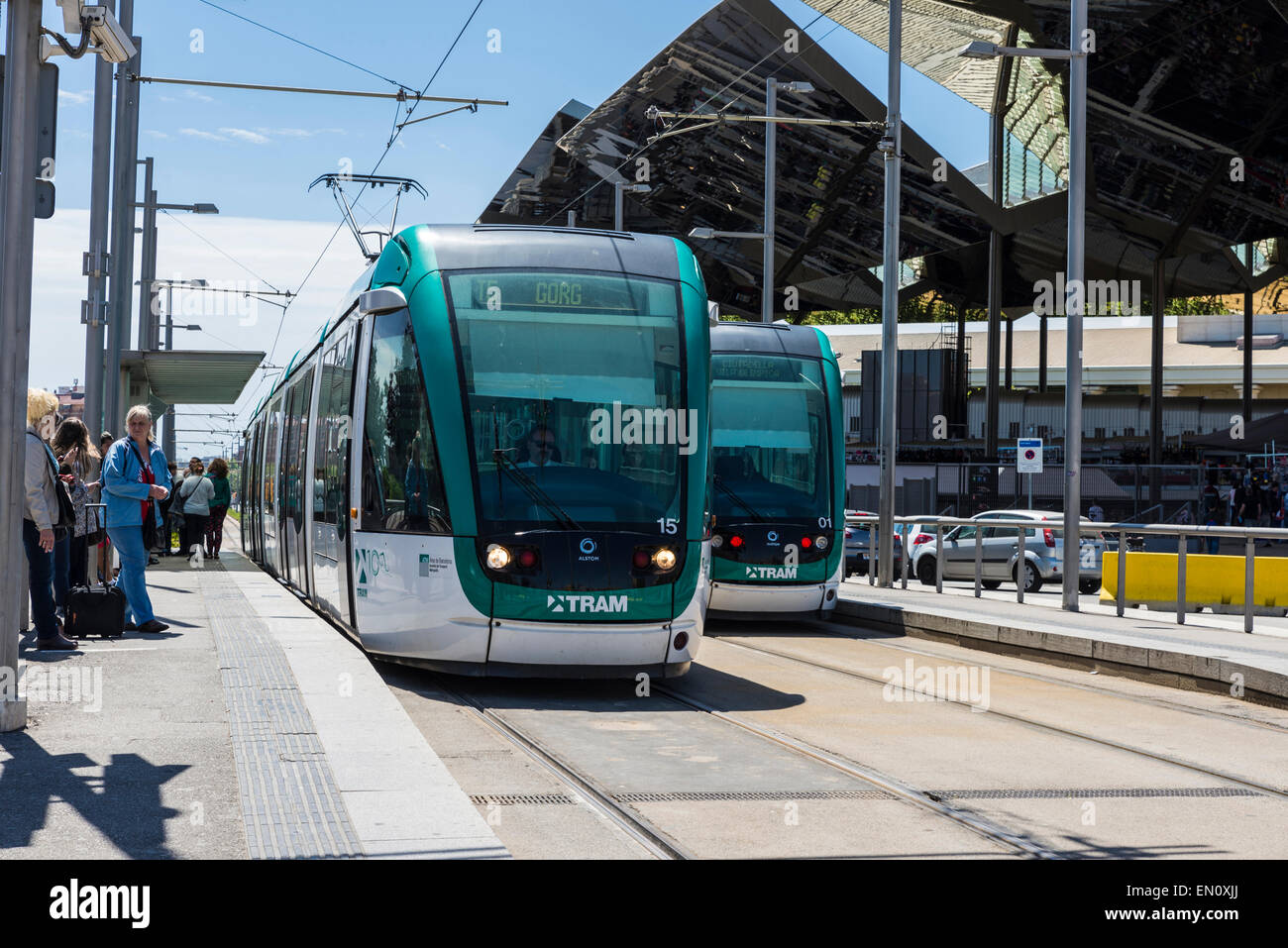 Barcelona tram known as Trambaix. In the picture the tram is stopped ahead of flea market Encants. Stock Photo