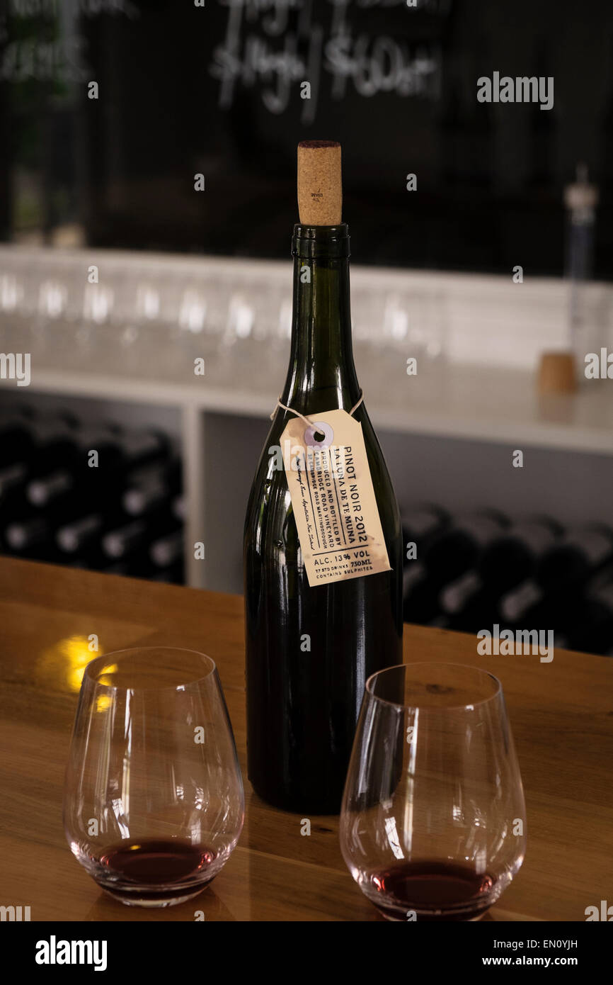 Bottle of Pinot Noir and tasting glasses at the Cambridge Road Vineyard, Martinborough, New Zealand. Stock Photo