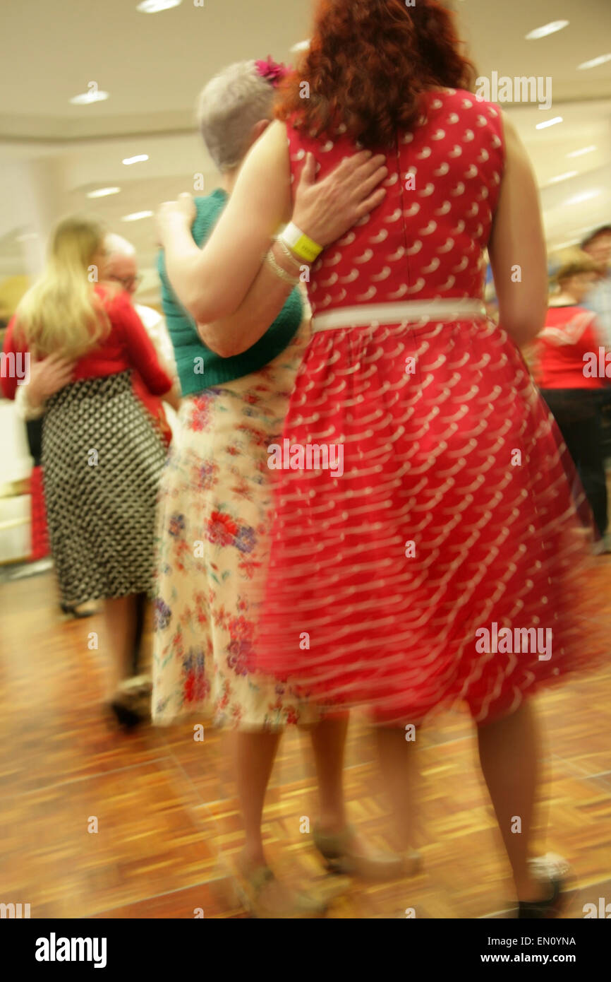 York, UK, 25 April 2015. Visitors in period dress dance to classic jive and swing songs at the Festival of Vintage at York Racecourse: an event showcasing and celebrating the fashion, beauty, cars, motorcycles, music and lifestyle from the 1930's to 1960's. Credit:  david soulsby/Alamy Live News Stock Photo