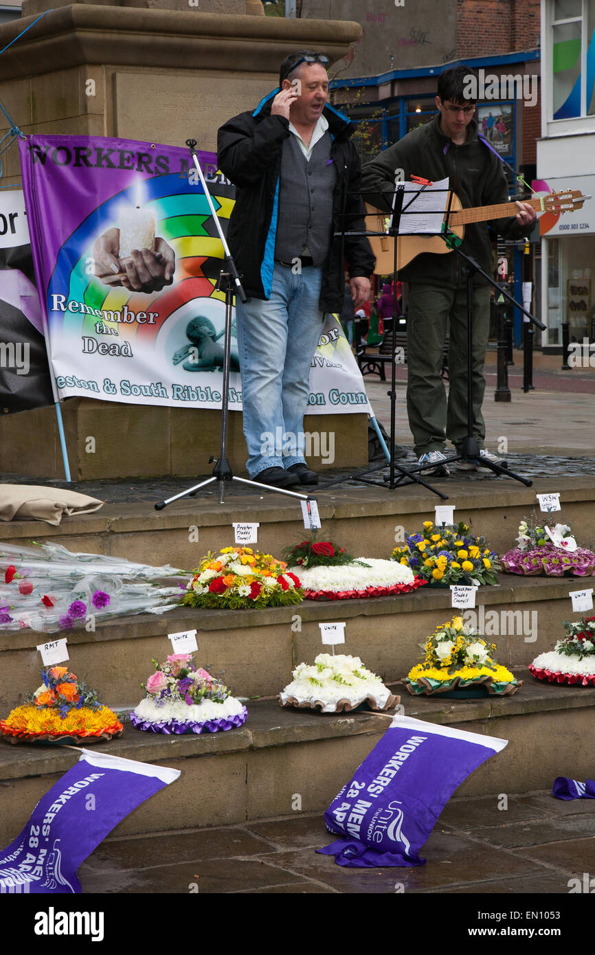Preston, Lancashire, UK 25th April 2015. Andy Birchall speaker at the International Workers Memorial Day event with memorial service, March & rally to acknowledge those killed, injured and made ill through work each year.  The Commemoration and Campaign at Preston Flag market this year is to remember the dead and fight for the living with disease and illness generated by hazardous substances such as Asbestos. Credit:  MarPhotographics/Alamy Live News. Stock Photo
