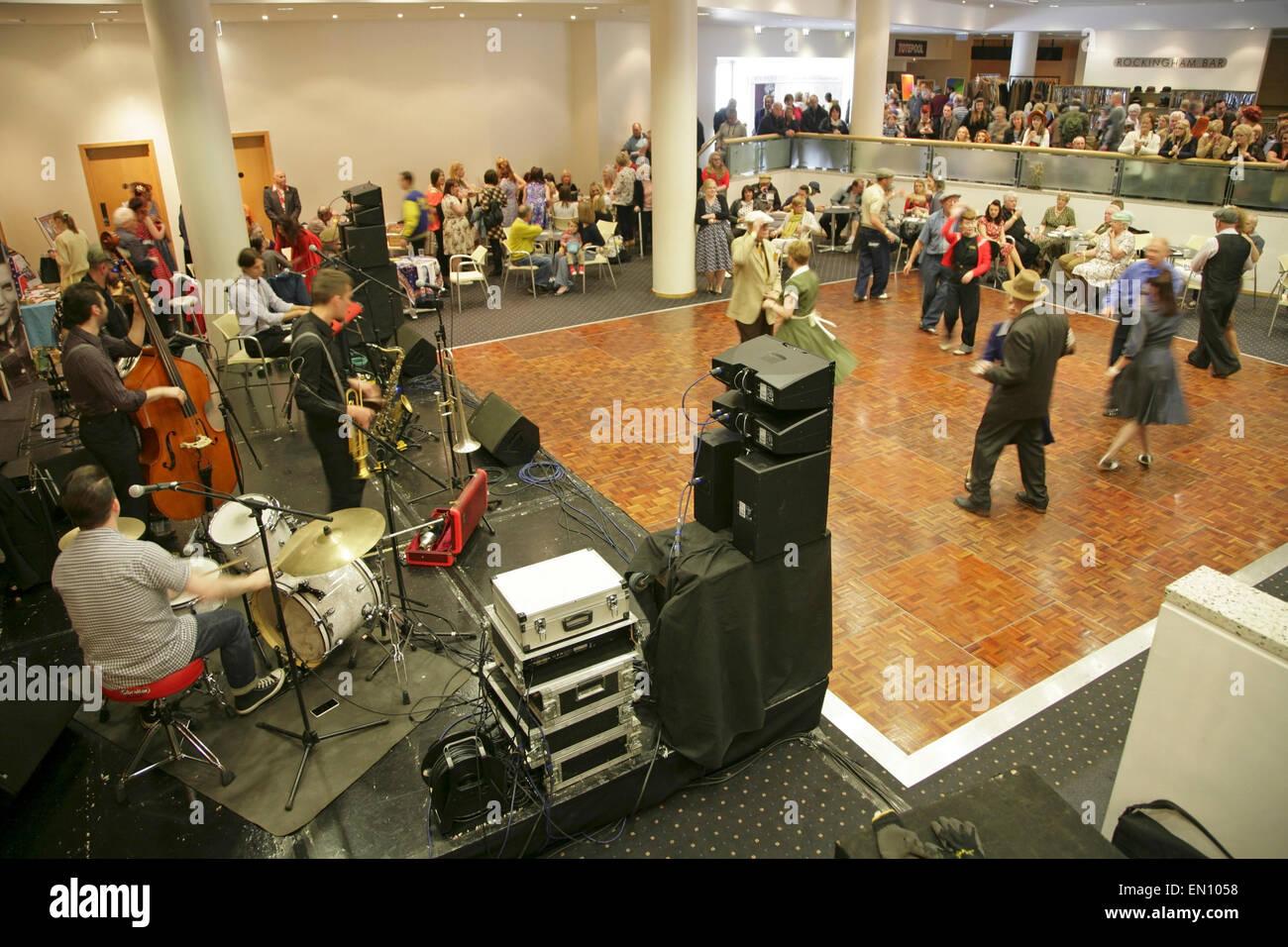 York, UK, 25 April 2015. Visitors dance to classic songs played by 'The Jive Aces' jive and swing band at the Festival of Vintage at York Racecourse: an event showcasing and celebrating the fashion, beauty, cars, motorcycles, music and lifestyle from the 1930's to 1960's. Credit:  david soulsby/Alamy Live News Stock Photo