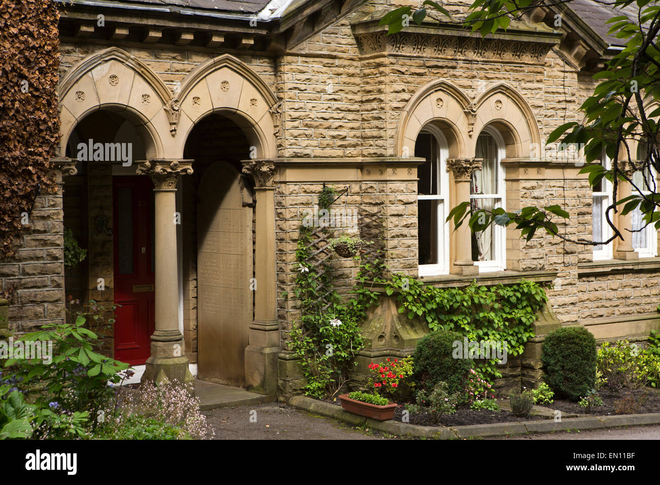 UK, England, Yorkshire, Bradford, Saltaire, Victoria Road, almshouse doorway Stock Photo