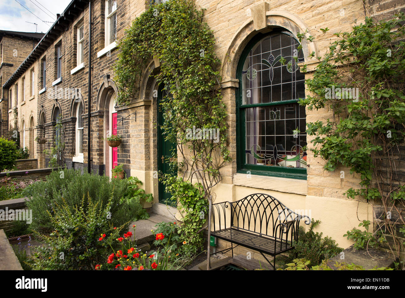 UK, England, Yorkshire, Saltaire, Henry Street, small front gardens of terraced houses Stock Photo