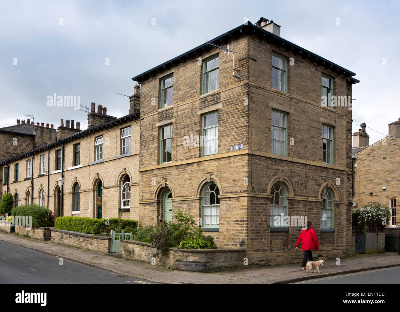 UK, England, Yorkshire, Saltaire, George Street, large house at end of terrace of workers homes Stock Photo