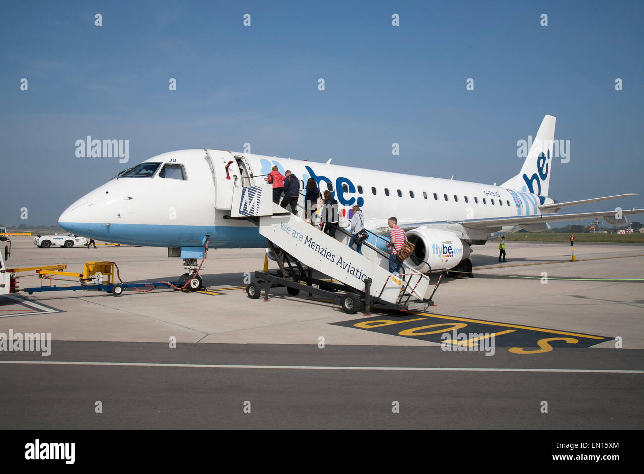 Boarding a Flybe aircraft at Guernsey Airport Stock Photo