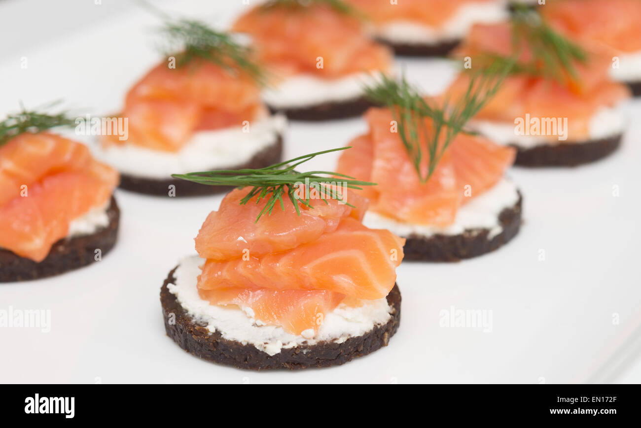 canapes with cheese and red fish Stock Photo