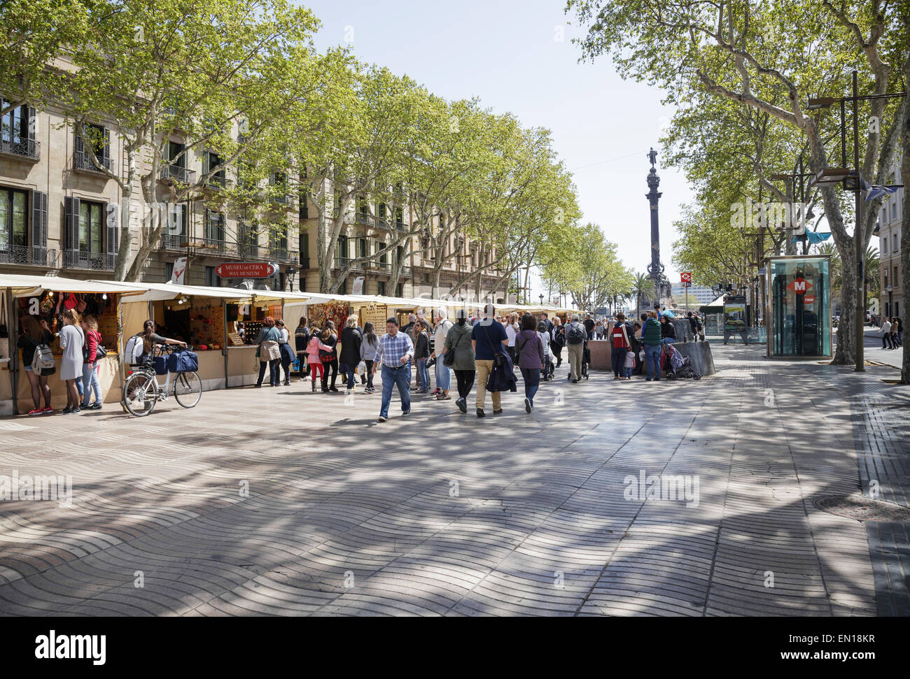 people walking on La Rambla with art and souvenir stalls, Barcelona, Catalonia, Spain Stock Photo
