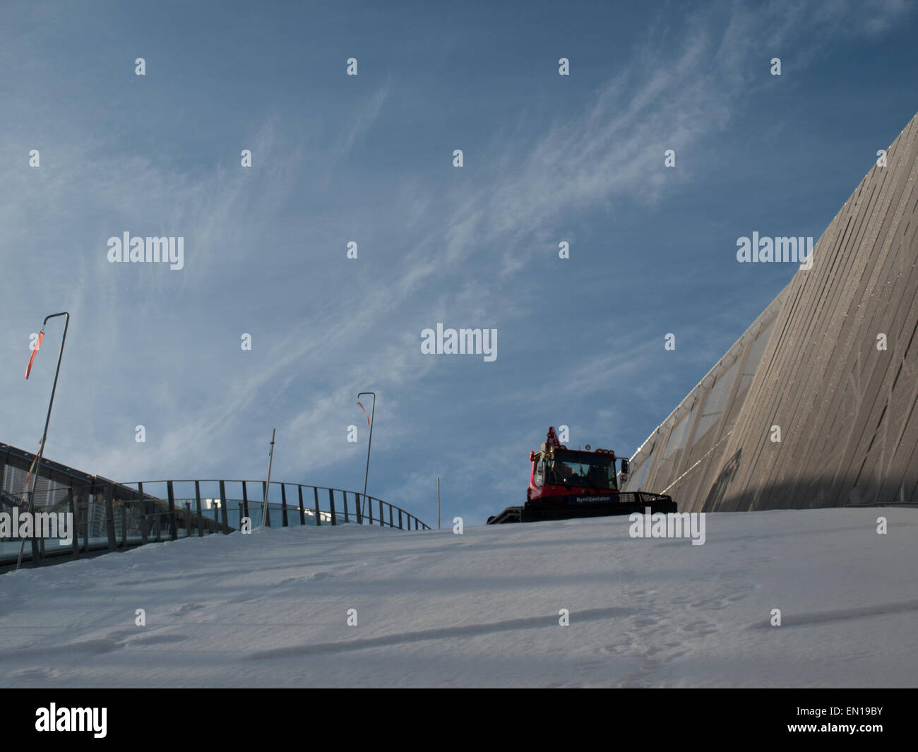 Lower view of a machine smoothing the snow in Oslo's jump ski Stock Photo