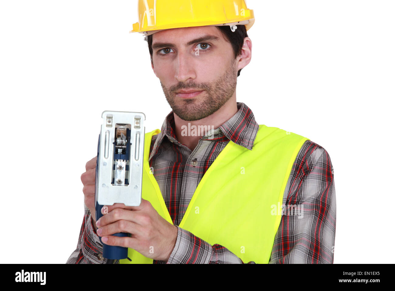 A manual worker with a jigsaw Stock Photo Alamy