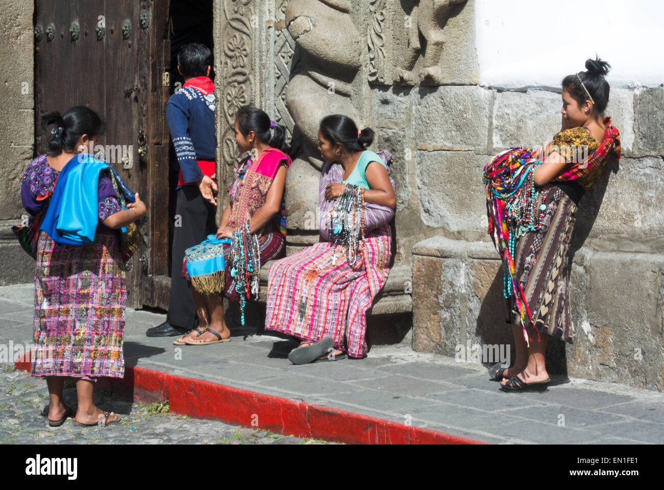 Beautiful Mayan women waiting to make a sale Stock Photo