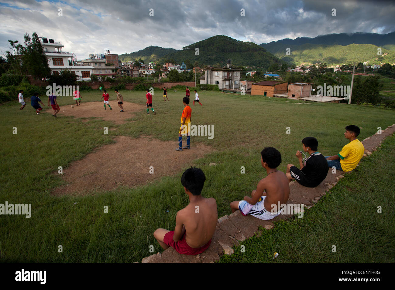 Team of boys playing football in outskirts of Kathmandu valley Stock Photo