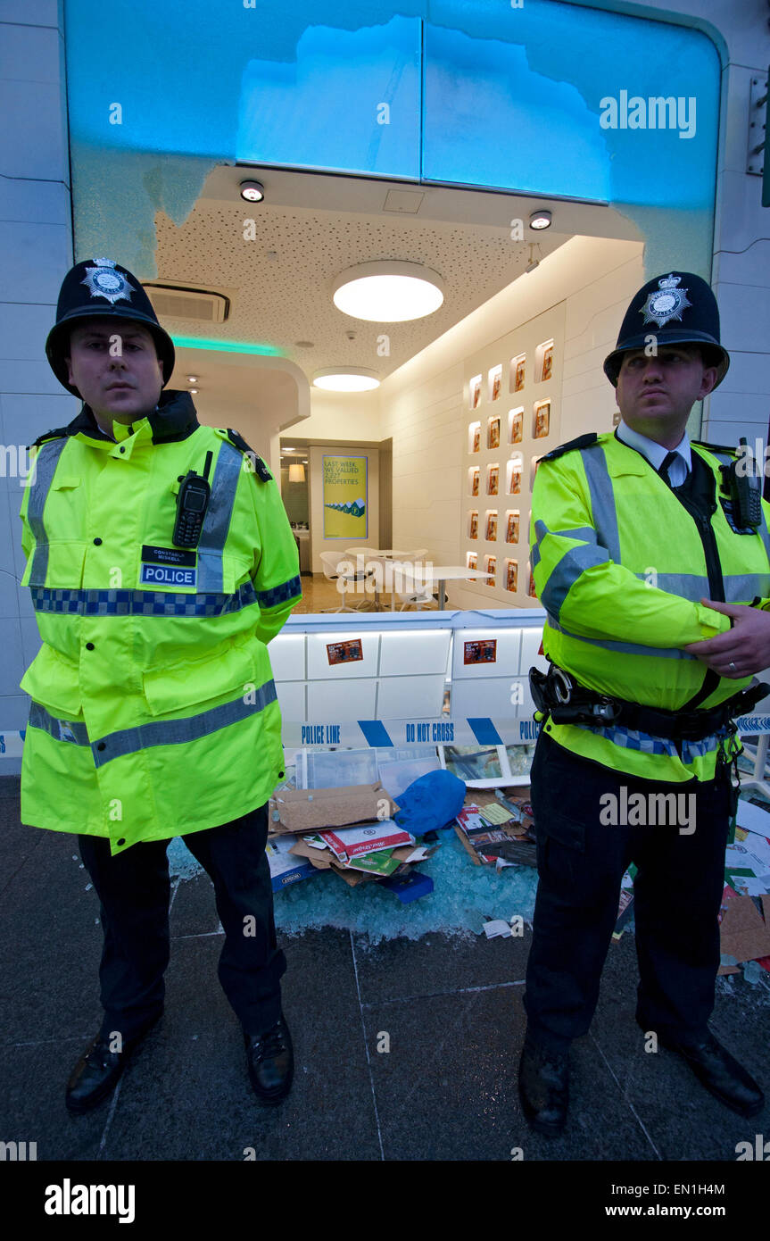 Foxtons Estate Agents window smashed and riot police using tear gas